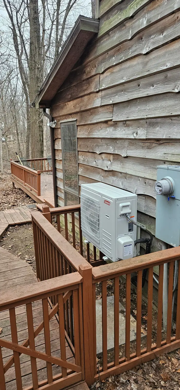 Coleman mini-split outdoor unit installed on cabin exterior in Terre Haute Indiana